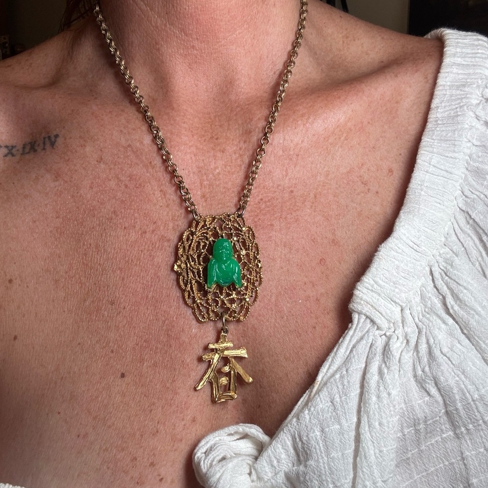 Vintage costume necklace. I believe it says “spring”